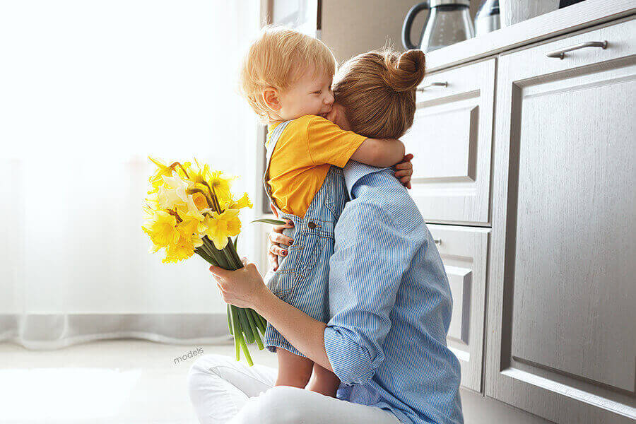 Mother and child hugging.