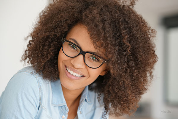 headshot of a woman in glasses